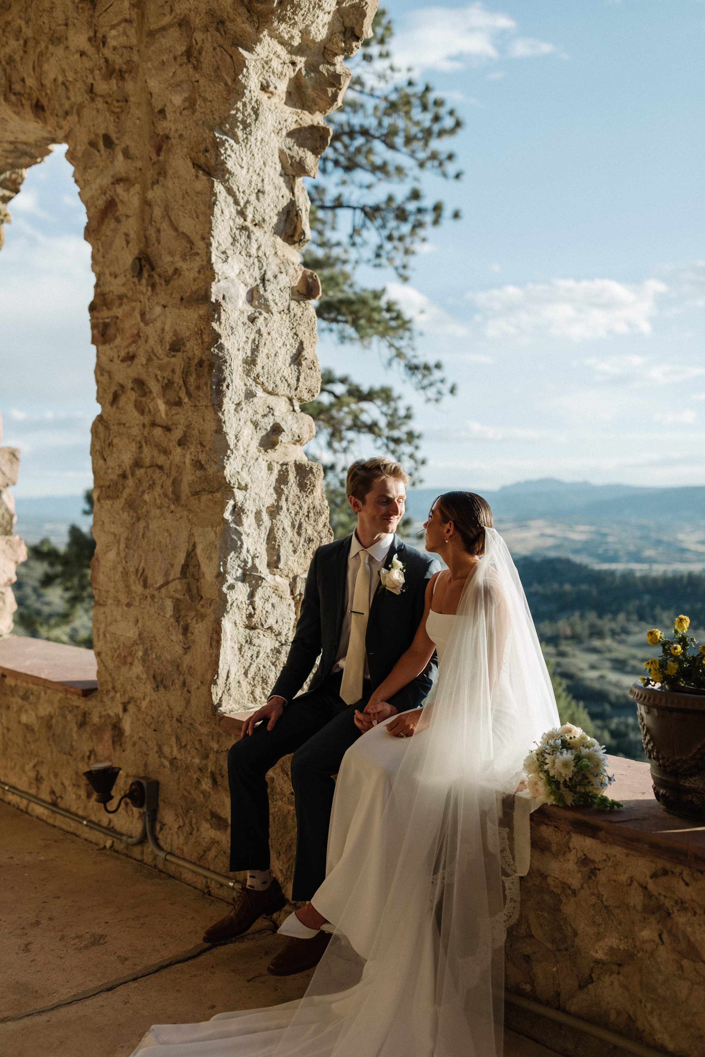 Stunning wedding photos with bride and groom overlooking lush mountain landscape